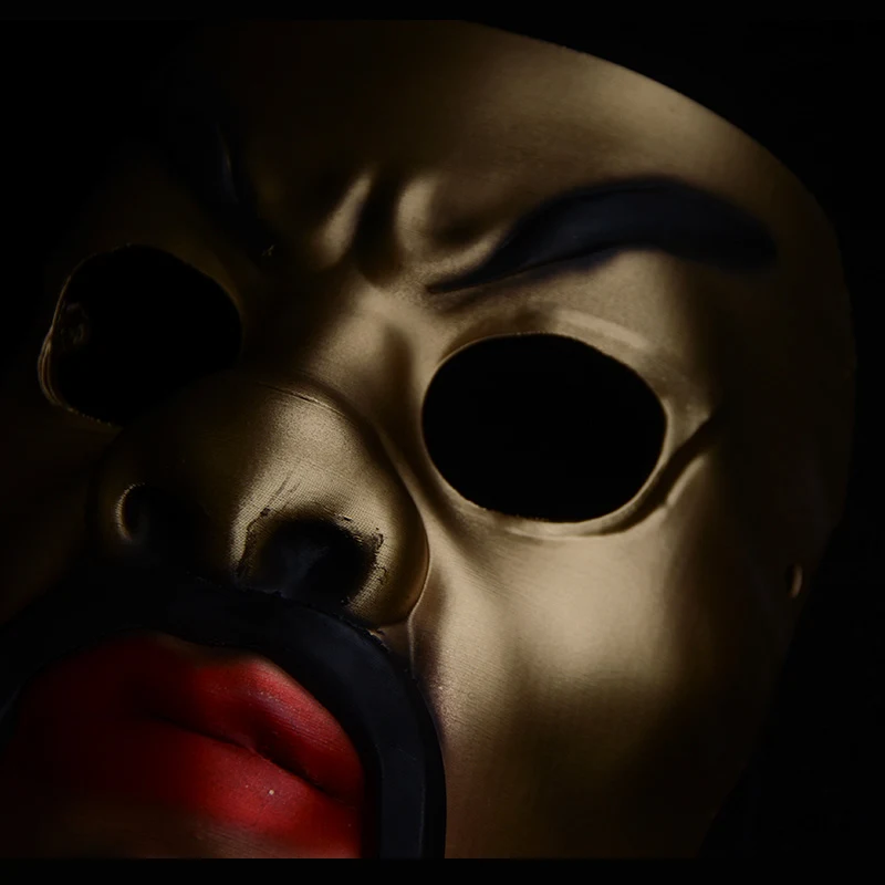 Gold-tone collectible mask detail